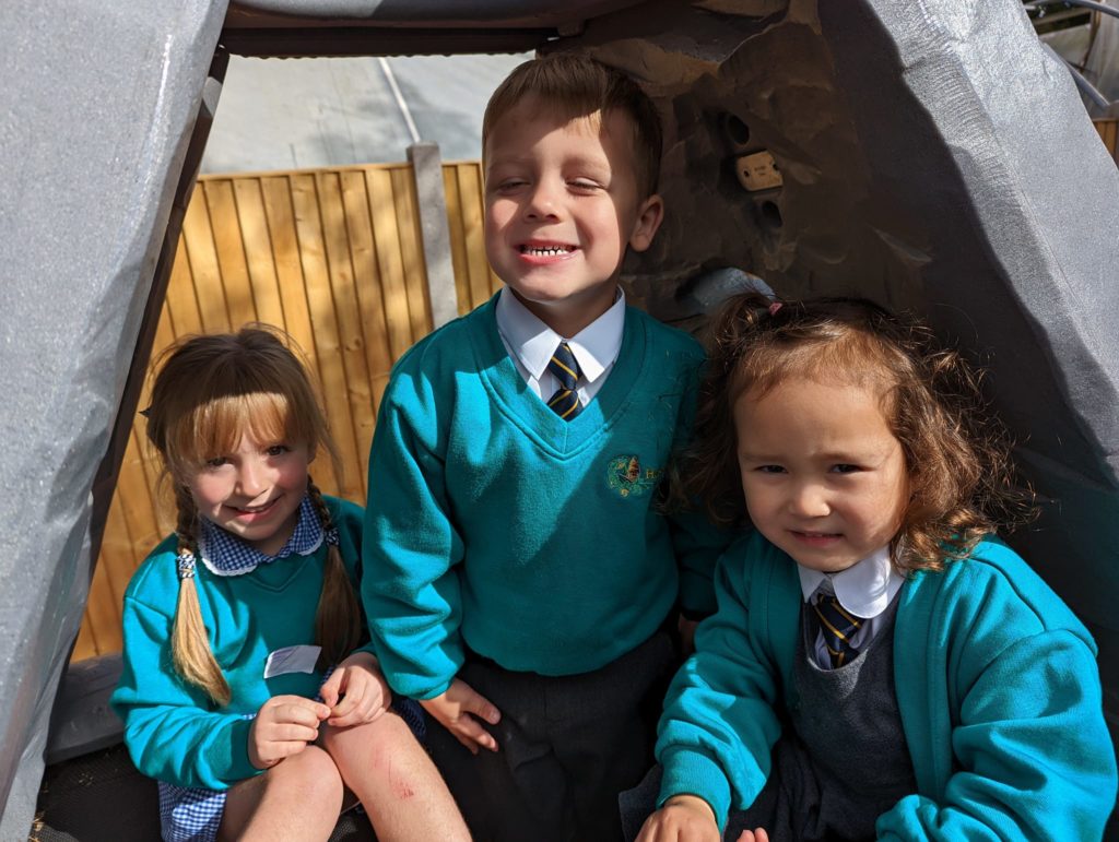 EYFS pupils are seen playing in and enjoying their new outdoor area on the academy grounds.