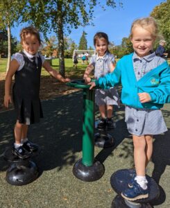 Horsmonden pupils are seen smiling for the camera whilst trying out the new outdoor Gym equipment on the academy grounds.