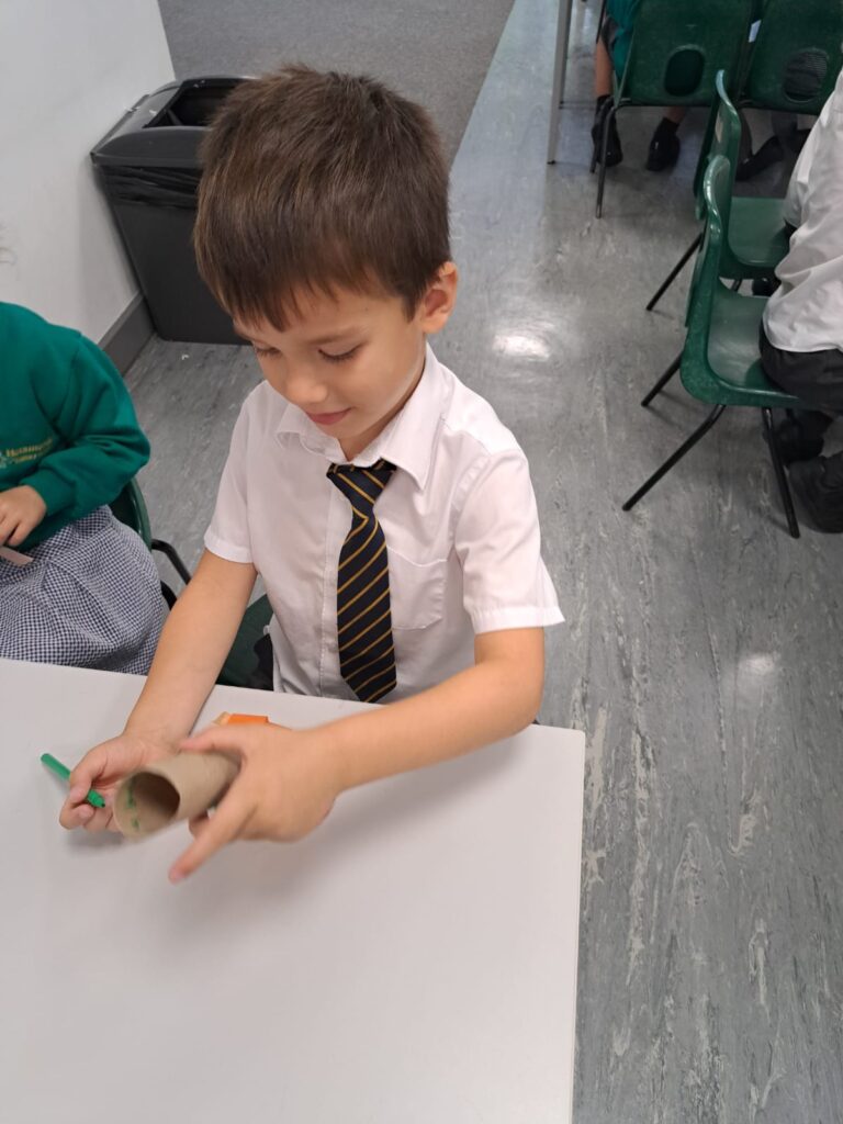 Year 1 pupils are pictured making their own Rockets in order to bring their Maths lesson to life!