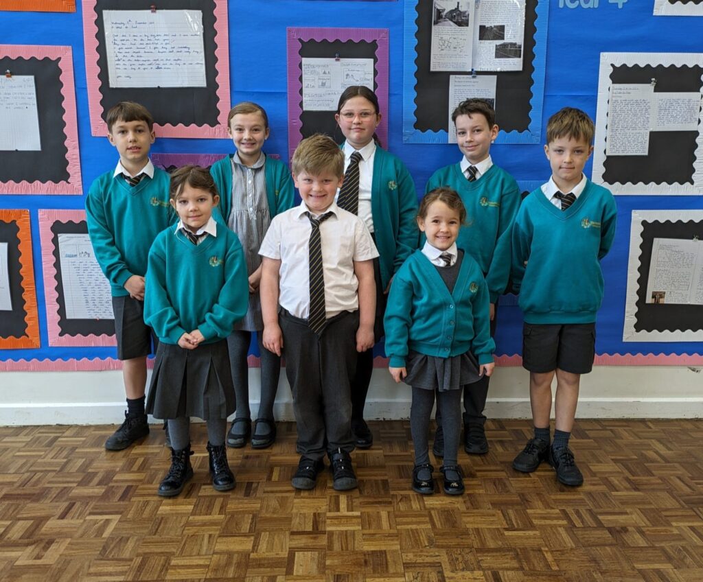 Photo showing winners of the Horsmonden Hero award smiling for the camera.